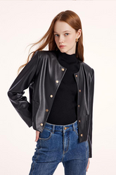 a lady in black leather jacket  with black turtle neck top